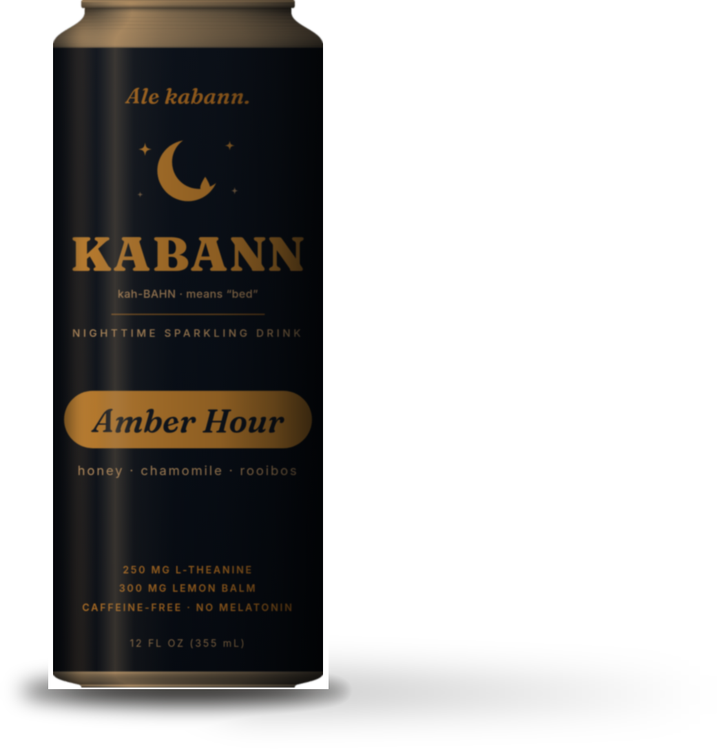 A KABANN Amber Hour can on a nightstand beside a warm lamp